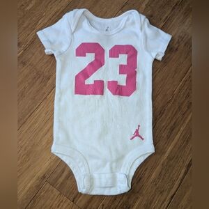 Jordan White bodysuit with Pink Number 23
